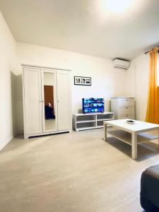 a living room with a couch and a table at Salis in Novigrad Istria
