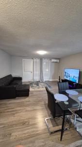 a living room with a couch and a table at Messila in Gatineau