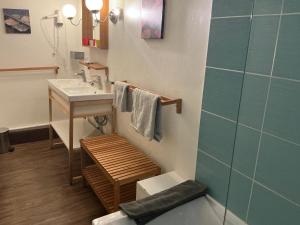 a bathroom with a sink and a toilet and a shower at Logis Domaine du Prieuré in Tonnay-Boutonne