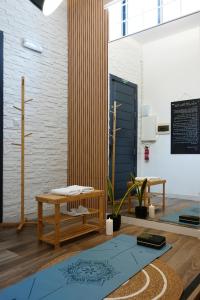 a room with a bench and a table and a door at Zen Loft Quiet Retreat near St julians in Is-Swieqi