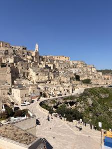 a view of a city with buildings on a hill at Casa Collina - Giardino in Pisticci