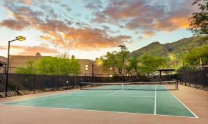 a tennis court with a tennis racket on it at Our Mountain View in Tucson