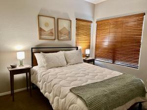 a bedroom with a large bed with two night stands at Our Mountain View in Tucson +34 photos