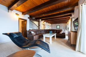 a living room with a couch and a table at Villa Azzurra in Krstac