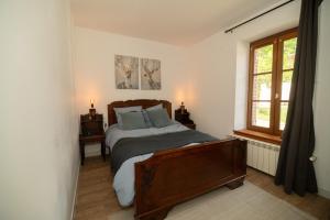 a bedroom with a bed and a window at Domaine du Riadoux in Bonneuil +41 photos