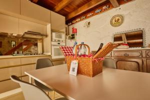 a kitchen with a table with baskets on it at Miragem do Douro in Marco de Canaveses +16 photos