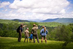 a group of people standing in a field at The Speckled Trout Outpost in Damascus