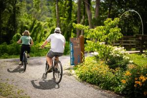 a man and woman riding bikes down a trail at The Speckled Trout Outpost in Damascus +59 photos