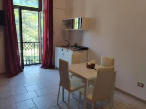 a kitchen and dining room with a table and chairs at Residenza Borgo Francescano in Gioia del Colle