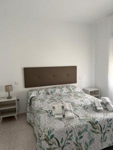 a bedroom with a bed with two pillows on it at Berta Home in Mota del Cuervo