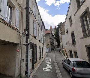 a car parked on a street in an alley at Studio de Dallet - Coeur de Ville in Clermont-Ferrand