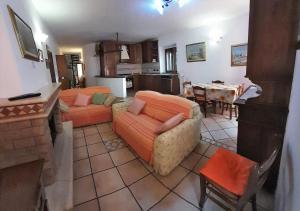 a living room with two couches and a table at Le Maree Susanna in Rio Marina
