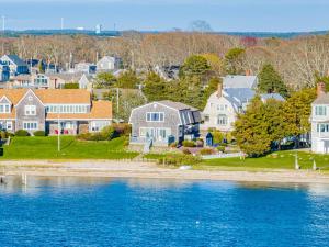 a view of a town with houses and the water at Cape Cod Waterfront with Stunning Views in Buzzards Bay