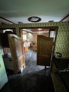 a room with a door and a living room at Dar Idurar in Imouzzer du Kandar
