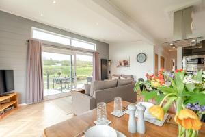 a living room with a couch and a table at 2 Bed in Canaston Bridge oc-d34702 in Robeston Wathen
