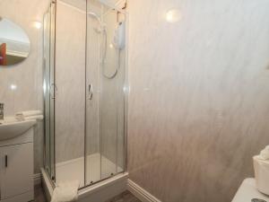 a shower with a glass door in a bathroom at Oak Tree in Weston-super-Mare +22 photos