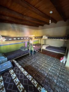 an overhead view of a room with three bunk beds at Casa los Molles Hostel in Maimará