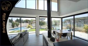 a living room with a couch and a table at Cassis Lodges in Cassis