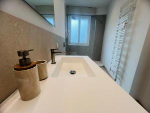 a bathroom with a bath tub with a window at Suite Luxury Seaview - Sanremo in Sanremo +18 photos