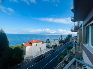 a view of the ocean from a balcony of a building at Suite Luxury Seaview - Sanremo in Sanremo