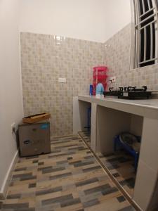a kitchen with a sink and a counter top at Sun house kendwa beach in Kendwa