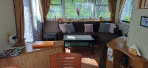 a living room with a couch and a table at Domek Boskovice in Boskovice