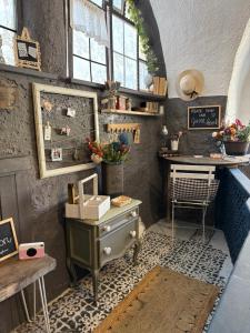 a room with a dresser and a desk in a room at La casa dei nonni in Bracelli +39 photos