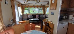 a kitchen and a living room in a caravan at Domek Boskovice in Boskovice