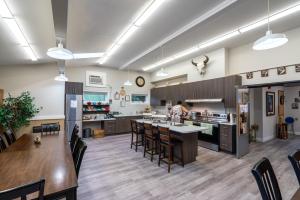 a kitchen with a person standing in the kitchen at Nekinan Lodge in Smoky Lake