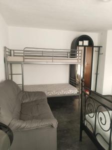 a room with two bunk beds and a couch at MEGA WEEKEND Apartment in Salzkammergut Nähe Attersee Traunsee Gmunden Bergen in Attnang-Puchheim +30 photos