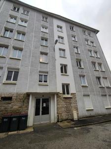 an apartment building with a large building at LEvasion de Brest - Près du Tram - 5 Voyageurs in Brest