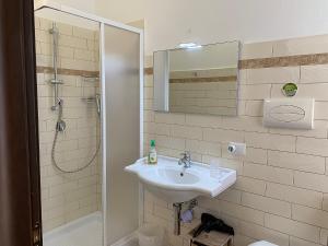 a bathroom with a sink and a shower at Agriturismo Vistamare in Orosei +162 photos