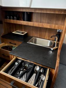 a kitchen with a sink and a counter top at Silent Jacht Solina in Polańczyk