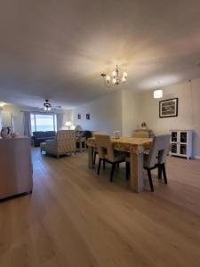 a dining room and living room with a table and chairs at CASA Allegro - Active Vacationers Paradise in Sun City West