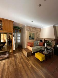 a living room with a couch and a table at Homeric Poems in Chios