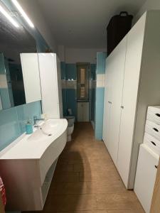 a bathroom with a sink and a toilet at Serena Guest House in Caserta