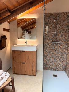 a bathroom with a sink and a shower at La casa Arancione in Boves +91 photos