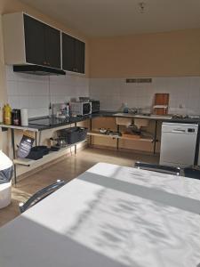 a large kitchen with a lot of equipment in it at chez MAG et YANN in La Séauve-sur-Semène