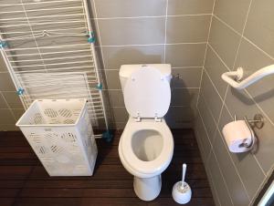 a bathroom with a white toilet in a stall at chez MAG et YANN in La Séauve-sur-Semène +14 photos