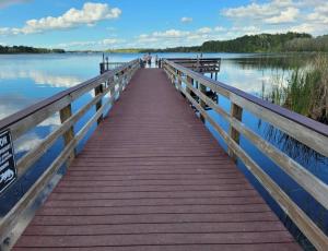a wooden bridge over a body of water at Andy's Hideaway at Bahama Bay - Sage Vacations in Kissimmee