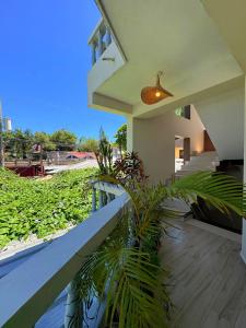 a balcony of a house with plants on it at Casa MIA in Cabarete