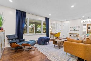 a living room with a couch and chairs and a table at Bright 3BR | 25 mins to Arrowhead | Groups & Pets in Mission