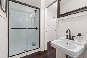 a bathroom with a sink and a shower at Bright 3BR | 25 mins to Arrowhead | Groups & Pets in Mission +14 photos