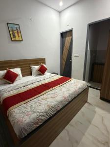a bedroom with a large bed in a room at Amrit bela in Haridwār