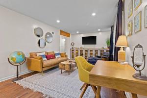 a living room with a couch and a table at Bright 3BR | 25 mins to Arrowhead | Groups & Pets in Mission
