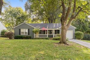 a house with a tree in the yard at Bright 3BR | 25 mins to Arrowhead | Groups & Pets in Mission