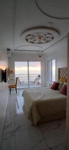 a bedroom with a bed and a view of the ocean at Blue ocean villa in Asilah +71 photos