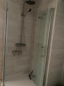 a shower in a bathroom with a glass shower stall at Casa Tomas in Albox
