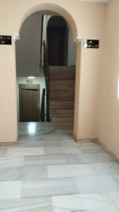 an empty hallway with a staircase in a house at Hotel Vista Alegre in Torredonjimeno