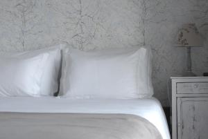 Uma cama ou camas num quarto em Casa com Historia